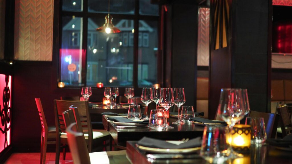 5 Restaurants You Should Try in Doylestown 1 A sophisticated restaurant interior with elegant table setting and ambient candlelight, creating a cozy atmosphere.
